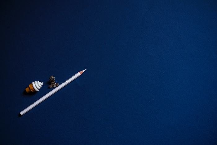 A pen on deep blue paper